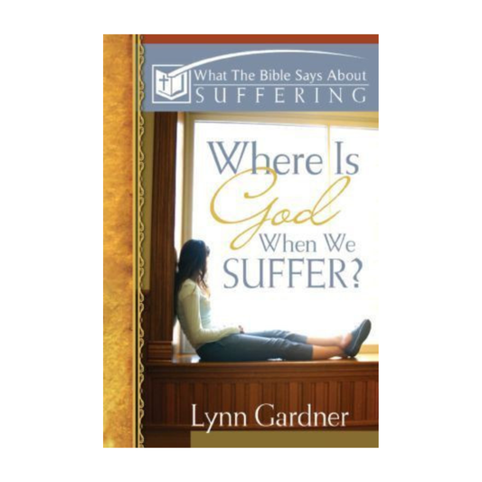 Book cover for 'Where Is God When We Suffer?' by Lynn Gardner, featuring a woman sitting by a window with the title in large blue and gold lettering, and a gray banner at the top reading 'What The Bible Says About Suffering'.